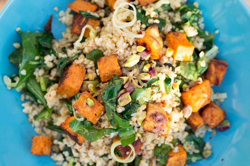 bulgur wheat sweet potato cubes tahini sauce close up