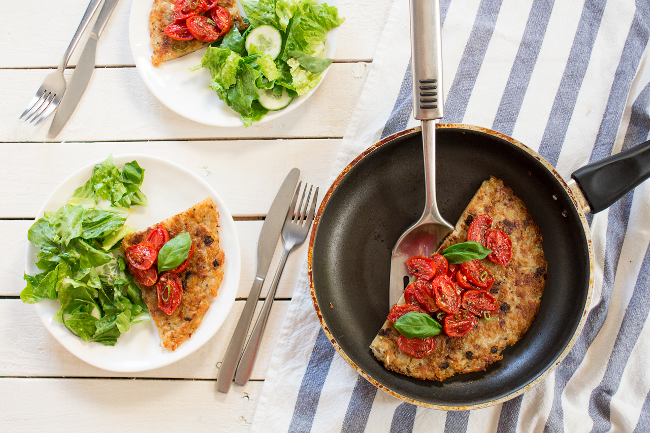 shredded potato rösti topped with garlicky tomatoes for two