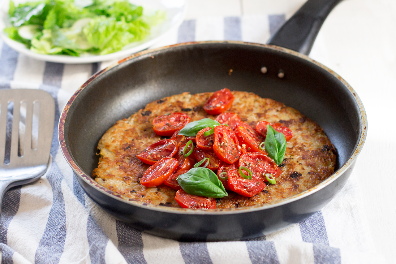 shredded potato rösti topped with garlicky tomatoes