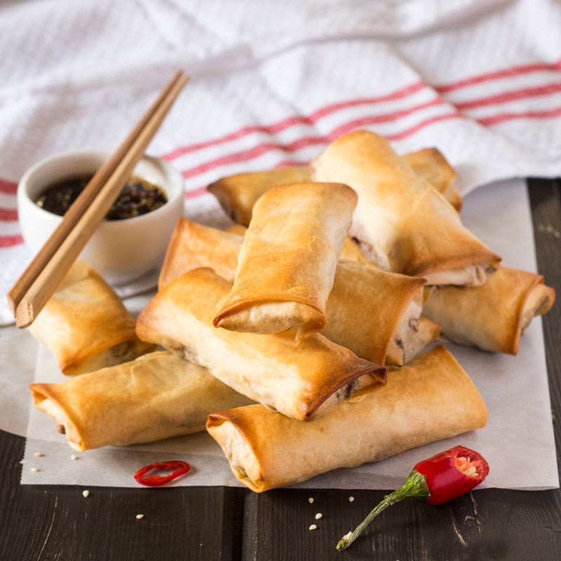 vegan baked spring rolls with a dipping sauce