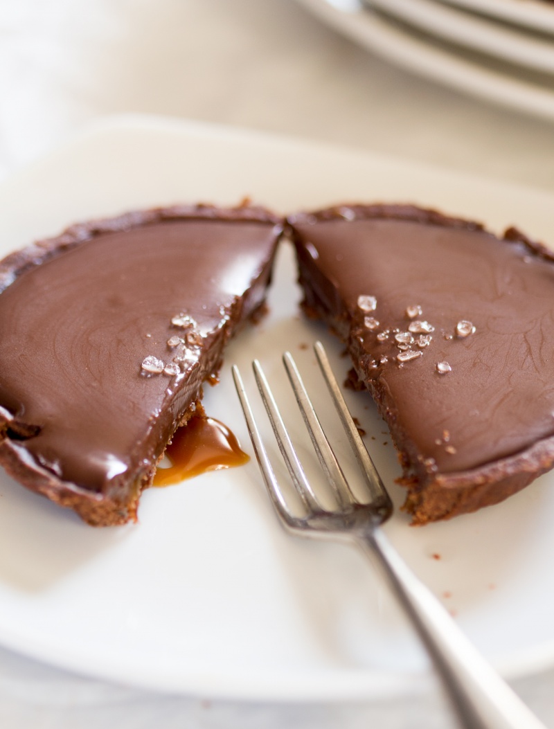 vegan chocolate and salted caramel tart cut in half