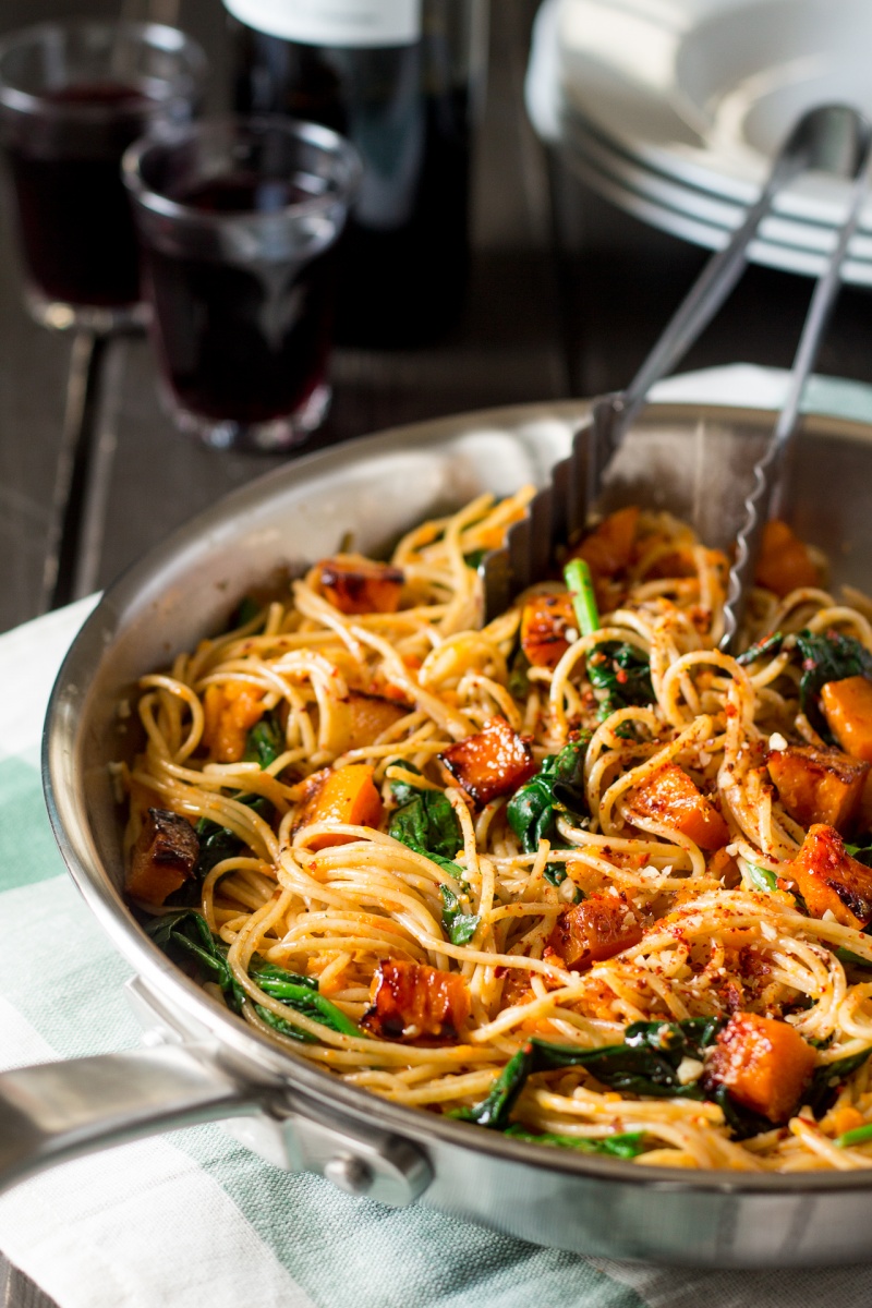 pumpkin spinach walnut spaghetti in a pan