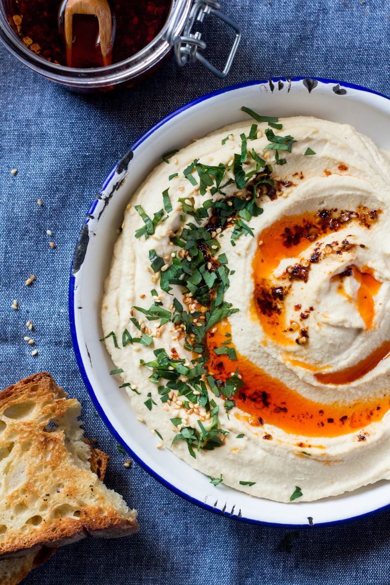 hummus topped with chilli oil in a bowl