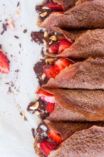 vegan chocolate crepes with hazelnut filling and strawberries