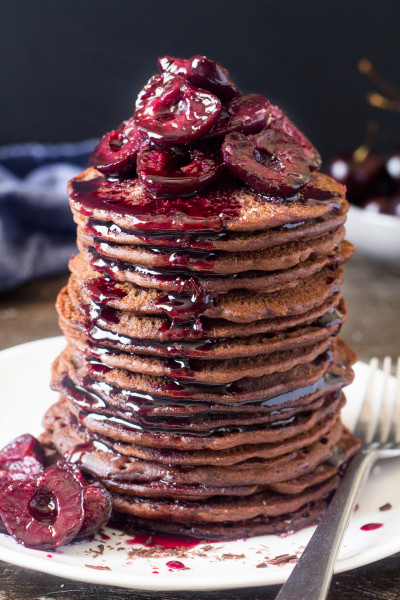 vegan chocolate pancakes with stewed cherries and syrup