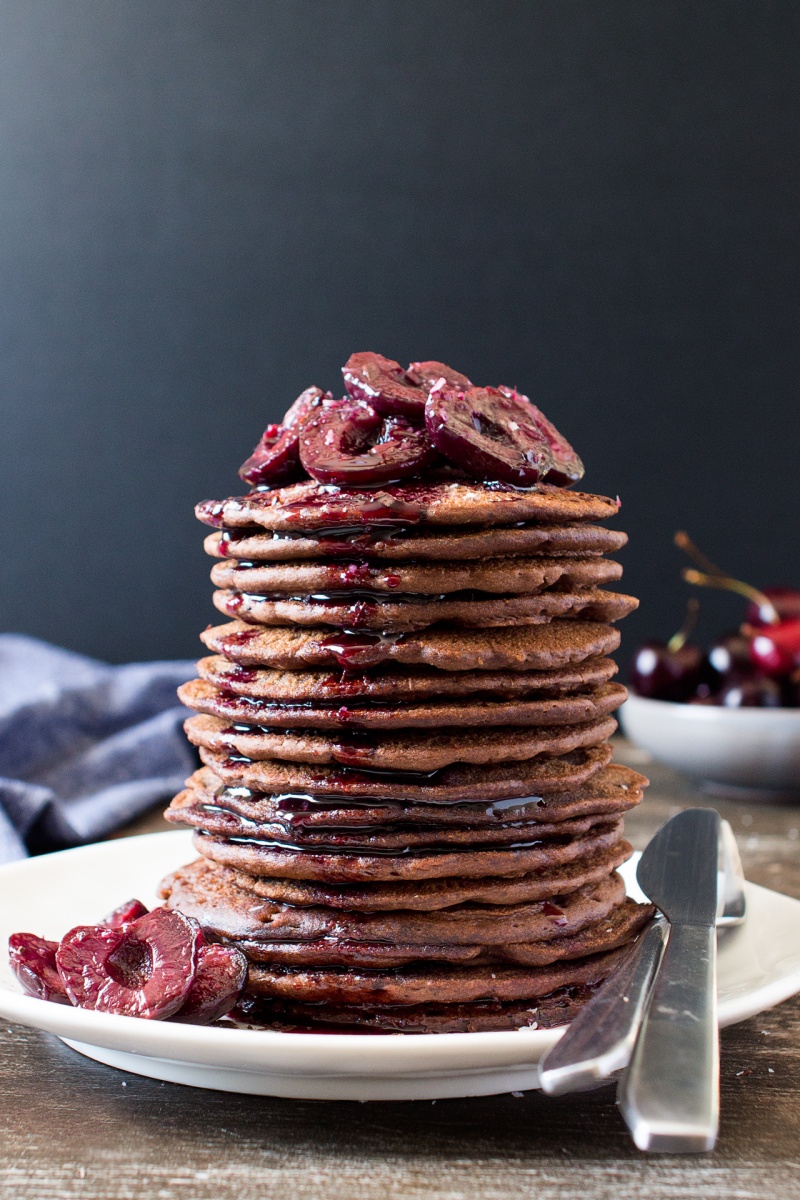 vegan chocolate pancakes with stewed cherries stack
