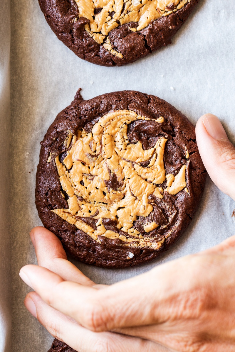 vegan brookies with peanut butter swirl hand