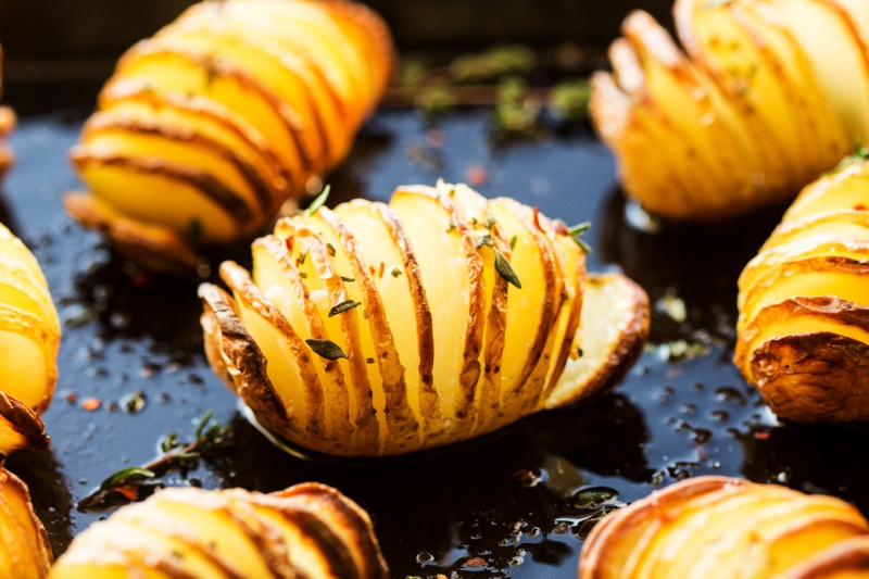 vegan hasselback potatoes back lit