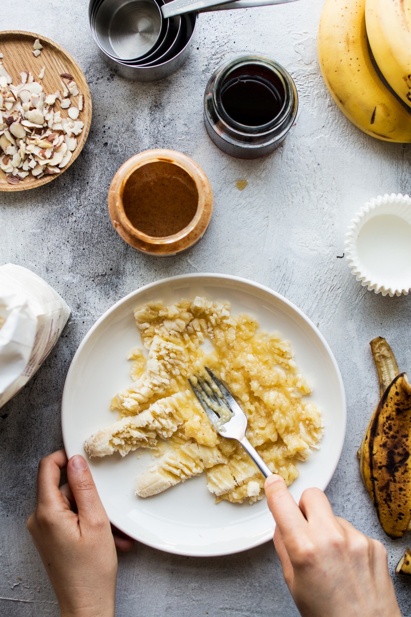 vegan banana bread muffins mashing banana