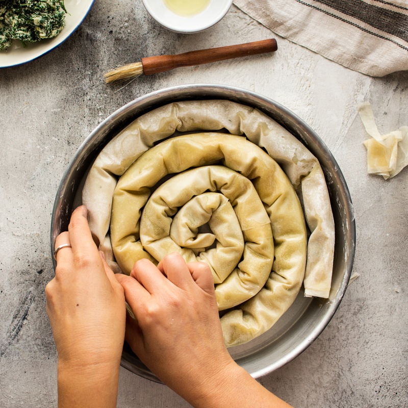 vegan spanakopita nesting in tin