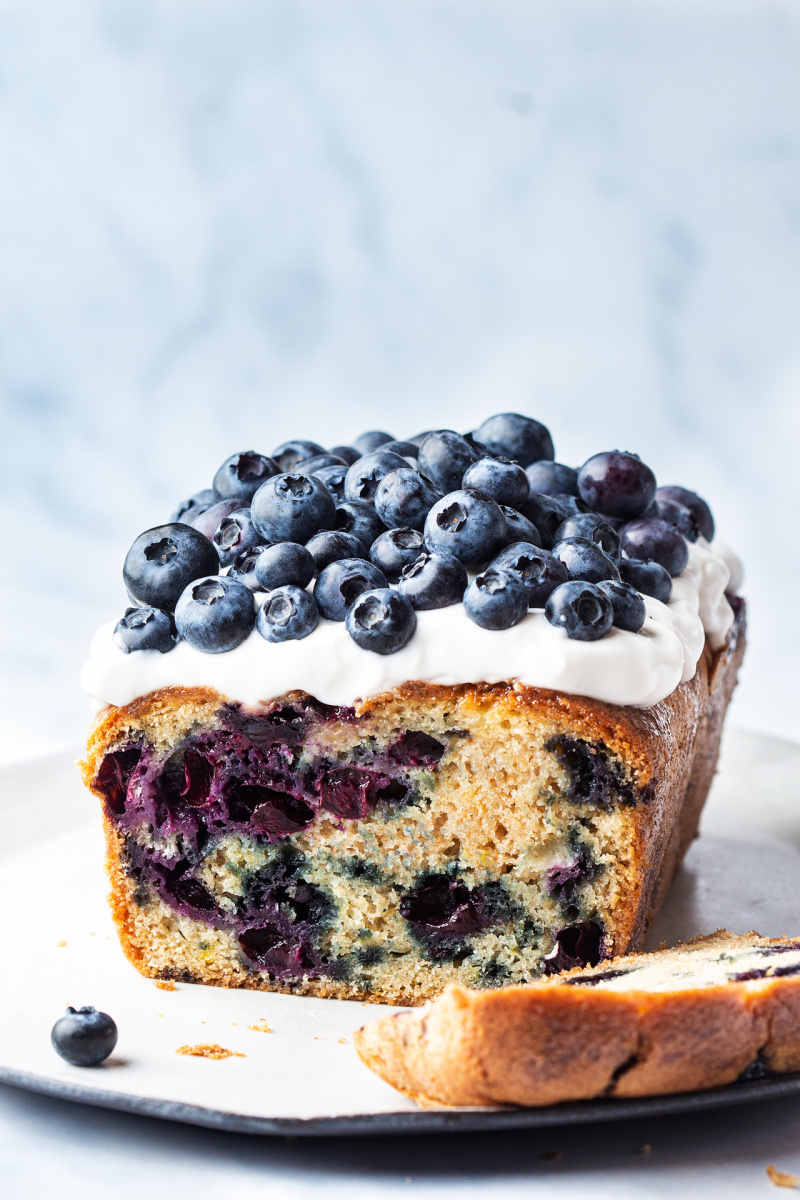 vegan lemon blueberry loaf topped yoghurt