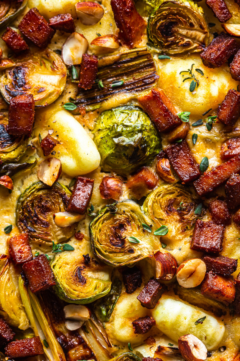 baked gnocchi sprouts leeks extreme close up