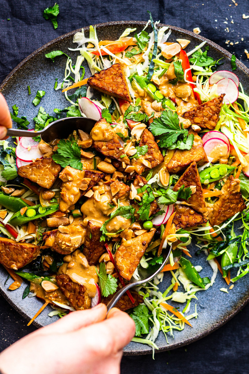 baked tempeh slaw mixing